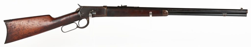 WINCHESTER MODEL 1892 LEVER ACTION RIFLE: SERIAL NUMBER: 520196 BARREL: 24" CALIBER: .25-20 WCF MANUFACTURED: 1908. Finished blue. Plain walnut stock and forearm. Rifle style, crescent butt plate. Octagon barrel. CONDITION: Good with blue/bro