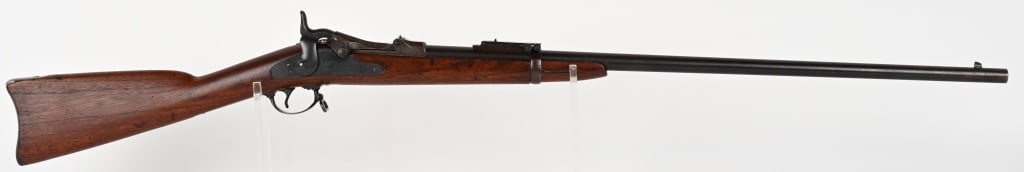US MODEL 1884 TRAPDOOR SPRINGFIELD CADET RIFLE: SERIAL NUMBER: 534822. BARREL 29 5/8". CALIBER 45-70. The rifle has been sporterized. It has a Buffington rear sight and pinned blade front sight. . Lock is marked US SPRINGFIELD with eagle in center.