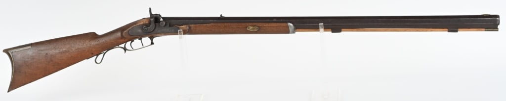 UNMARKED PERCUSSION HALF STOCK PLAINS RIFLE: BARREL 32". CALIBER 45. Walnut half stock, full octagon barrel, pewter tip, double set triggers, iron hardware, brass furniture, replacement wood rod, Working set triggers. CONDITION: Smooth patina. e