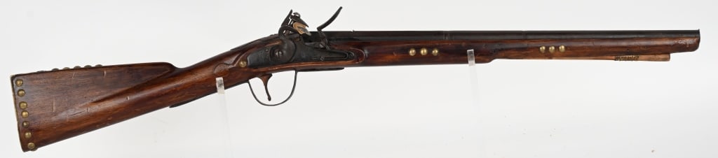 BRITISH FLINTLOCK INDIAN TRADE RIFLE: SERIAL NUMBER: N/A, BARREL: 21 1/4", CALIBER: about .60, Indian trade rifle that has been period shortened for horseback. Features original flintlock configuration, brass serpant side plate and butt p