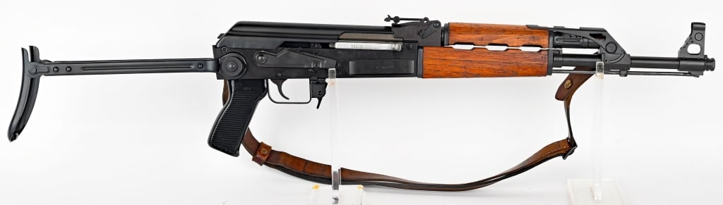 ZASTAVA - KRAGUJEVAC UNDER FOLDER AK-47 7.62X39: SERIAL NUMBER: C-86249 BARREL: 16 1/2" CALIBER: 7.62 X 39 MM MANUFACTURED: 1990 - 2000 IMPORTED BY CNC WARRIOR. Metal is blued finished with standard sights and grenade launching sight is attached. Wo