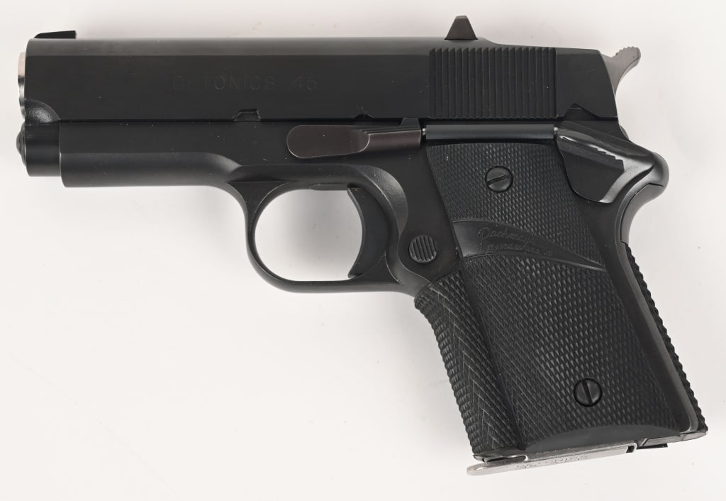 DETONICS 45 SEMI AUTO PISTOL: SERIAL NUMBER: C21212. BARREL: 3 ½". CALIBER: .45 ACP. Arguably the first compact 1911, made by Detonics in the late 1970s - 1980s. Detonics was the choice of Sonny Crockett as his backup gun in 