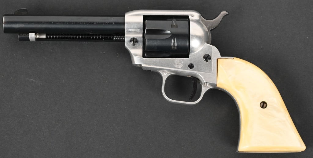 COLT SINGLE ACTION FRONTIER SCOUT .22: SERIAL NUMBER: 10895Q. BARREL: 4 ¾". CALIBER: .22 LR. MANUFACTURED: 1958. This Colt single-action revolver features an aluminum frame with blued finish on screws, barrel & cylinder, faux pearl gr