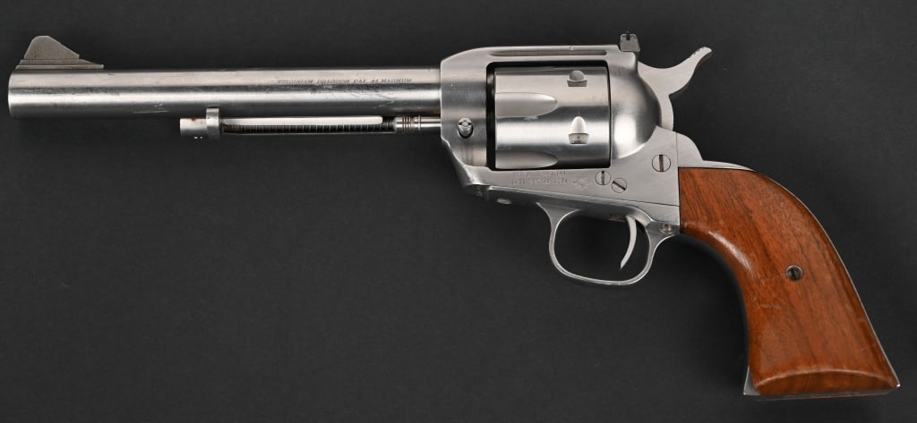 INTERARMS VIRGINIAN DRAGOON .44 MAG REVOLVER: SERIAL NUMBER: S34501. BARREL: 8 3/8". CALIBER: .44 MAGNUM. The Interarms Virginian Dragoon is a single action revolver known for its robust build and .44 Magnum chambering. It was manufactured by Int