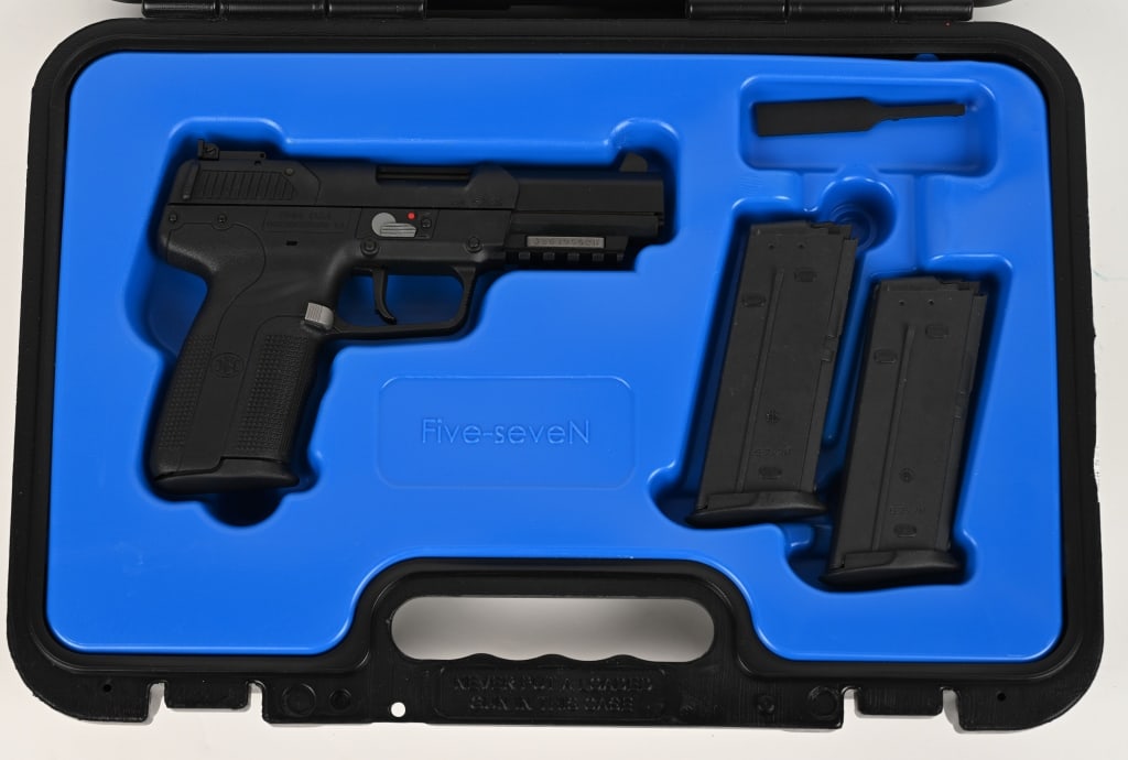 FIVE SEVEN MKI SEMI AUTOMATIC PISTOL: SERIAL NUMBER: 386195526. BARREL: 5". CALIBER: 5.7X28MM. The FN fiveSeven features a matte black polymer frame with checkered grip, matte black steelslide, ambidextrous safety lever, 3-dot sight confi