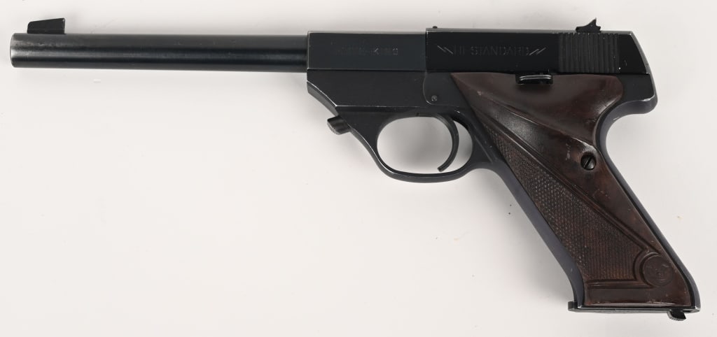 HI-STANDARD FLITE KING SEMI AUTO PISTOL 22 SHORT: SERIAL NUMBER: 444379. BARREL: 6 ¾". CALIBER: .22 SHORT. MANUFACTURED: 1953. Blade front sight and u-notch rear. Factory blued finishes. Checkered brown plastic grips. Includes original blued ste