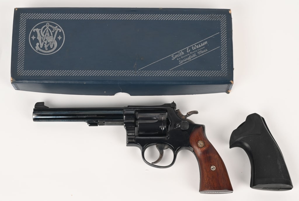 SMITH & WESSON MODEL 14-3 K38 REVOLVER 38 SPL: SERIAL NUMBER: 1K98125. BARREL 6". CALIBER .38 SPECIAL. MANUFACTURED 1971. Features of this 3-screw design model 14: blued finished with Patridge front target sight and adjustable rear sight, "K" fram