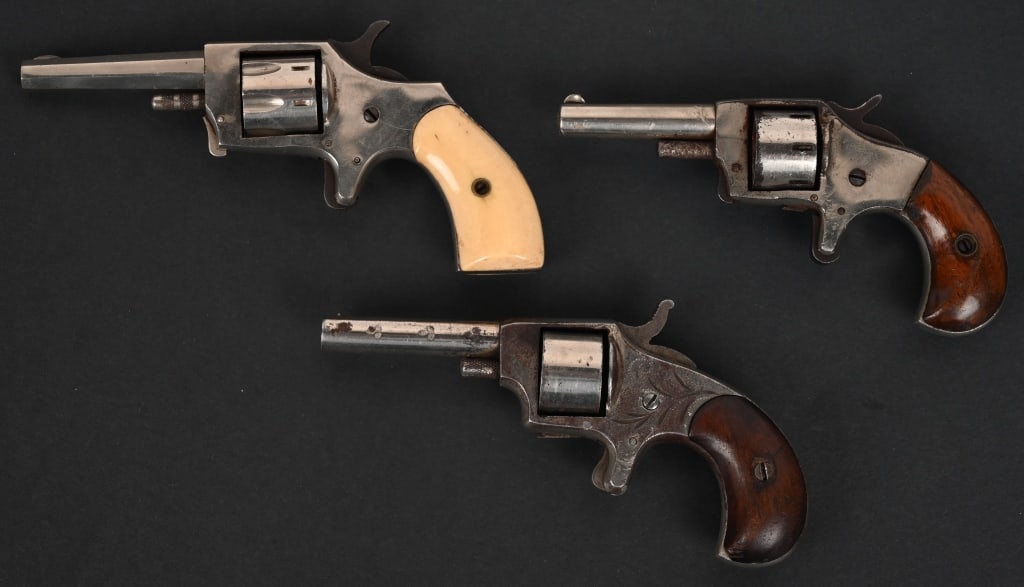 LOT OF 3 ANTIQUE 22 RF REVOLVERS: THE "TRAMPS TERROR" SPUR TRIGGER REVOLVER SERIAL NUMBER: NSN. BARREL: 2 ½". CALIBER: .22 RF. This is the "Tramps Terror" spur trigger pocket revolver, engraved, unmarked with manufacturer but lik