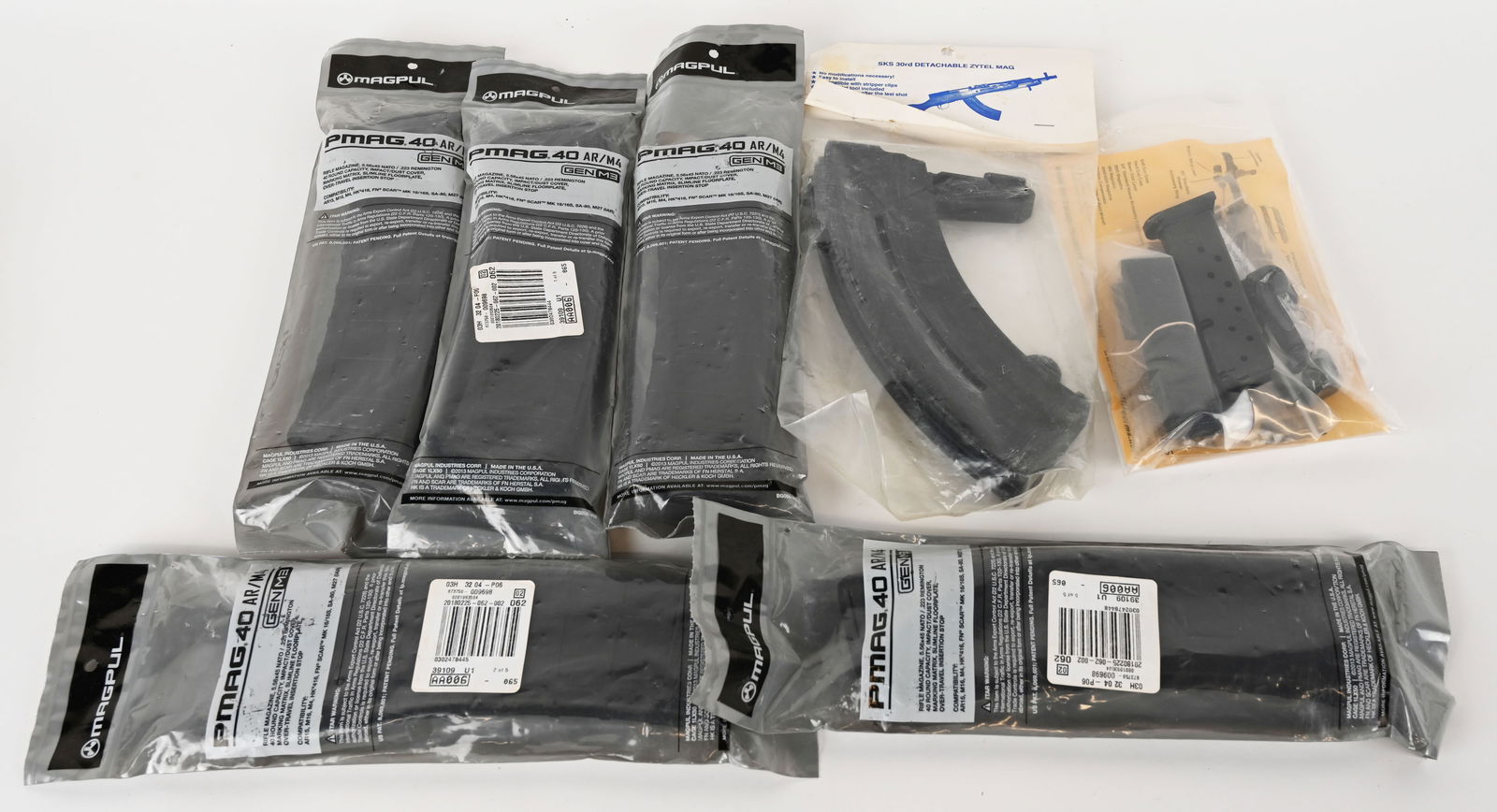 LOTS OF MAGAZINES: This lot contains: (1) 10 rd. High Point metal 9mm magazine (1) 30 rd. SKS detachable Zytel magazine (5) 40 rd. PMAG AR/M4 Gen 3 polymer magazine