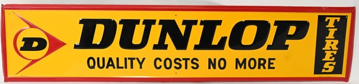 DUNLOP TIRES QUALITY COSTS NO MORE SIGN
