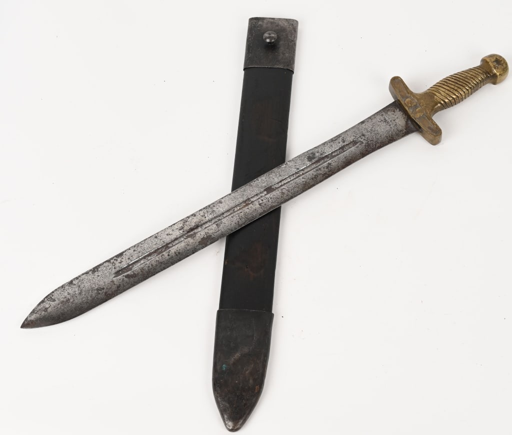 CONFEDERATE ARTILLERY SHORT SWORD W SCABBARD: This is a rare, CS & Star short sword in really nice, untouched condition. The scabbard in fact, is in fine condition considering the age and heavy use that most of these weapons bore. The staining an