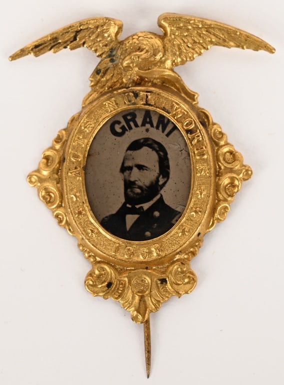 CIVIL WAR GENERAL US GRANT PORTRAIT FERROTYPE: Ulysses S. Grant: A Virtually Mint Ferro in one of the Most Attractive Brass Shell Frames. "Acts Not Words" around the bold oval ferro with "Grant" above his portrait, and the date "1868" below. A gor