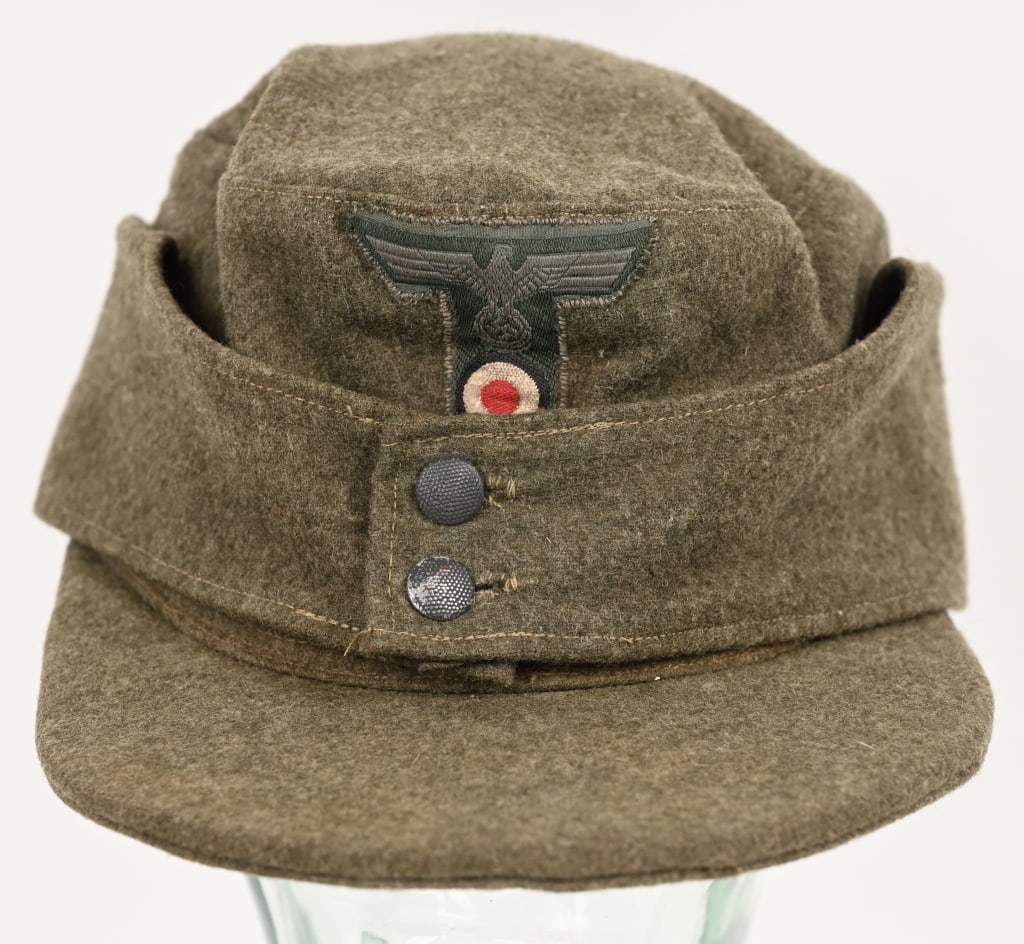 WWII NAZI GERMAN HEER M43 EM/NCO FIELD CAP OR HAT: Field-gray, wool/rayon blend construction cap features fold down back and side panels with a downward scalloped front edge and forward sides and two button front closure. The back and side panels were