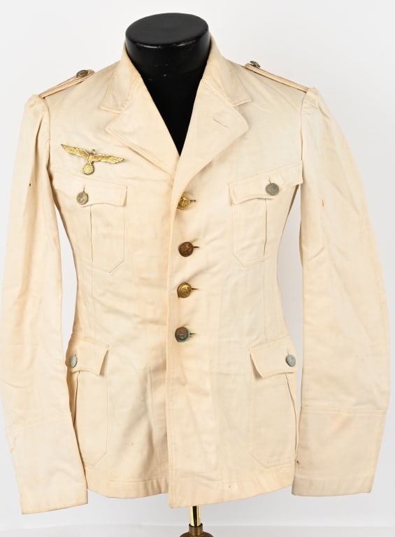 WWII NAZI GERMAN KRIEGSMARINE TROPICAL TUNIC U-190: Nice quality, 1937 pattern, white rayon/cotton blend tunic features a vertical, four button front closure with small fold back peak lapels and a lay down collar. The tunic has four, pleated patch fron