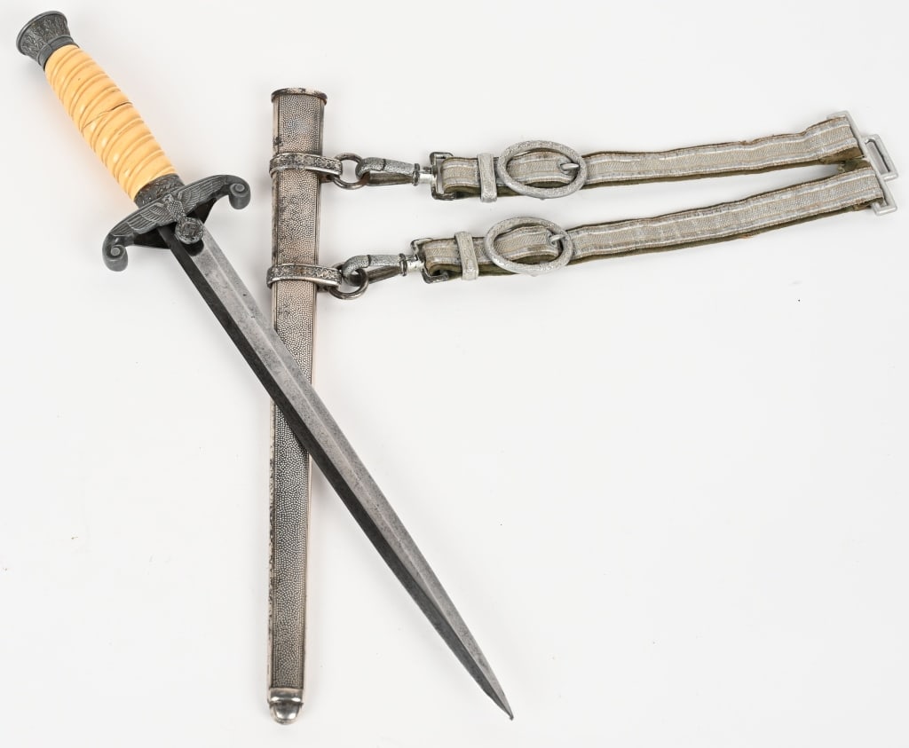 WWII NAZI GERMAN ARMY OFFICER DAGGER BY WKC WW2: The dagger features a roughly, 26cm long drop forged steel construction nickel/silver plated stiletto style blade with a flat central ridge. Blade shows typical scabbard runner marks and very minor sh