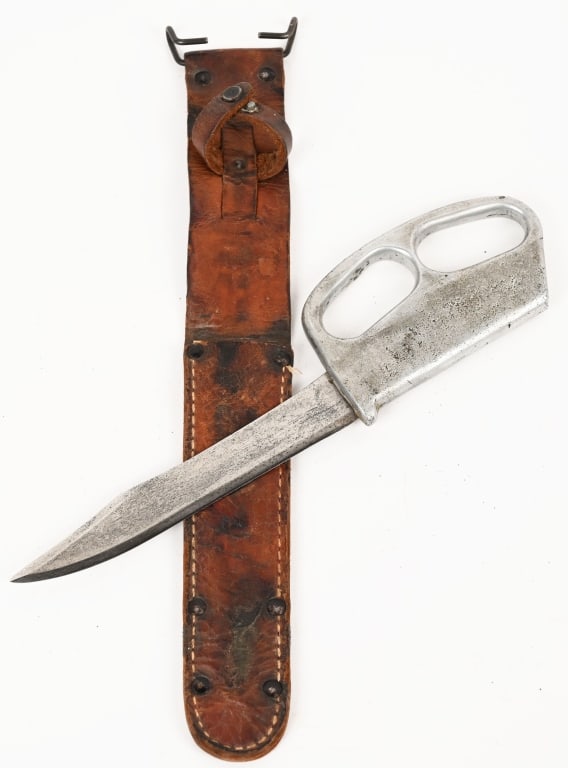 WWII THEATER MADE KNUCKLE FIGHTING KNIFE WW2: WWII Theater Made Fighting Knuckle Knife measuring 12 1/4 inches with a 6 3/4 inch blade. The aluminium crafted handle makes it a very well balanced fighting knife. The leather scabbard is a