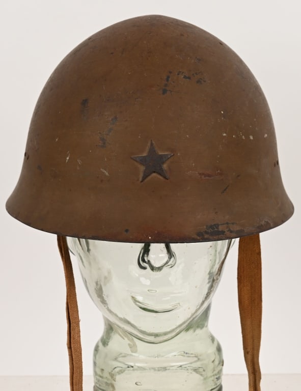 WWII IMPERIAL JAPANESE TYPE 90 COMBAT HELMET WW2: The standard WWII Japanese infantry combat helmet. The shell constructed from chrome molybend steel shows loads of minimal period wear and combat use. The original IJA metal star affixed to the front.