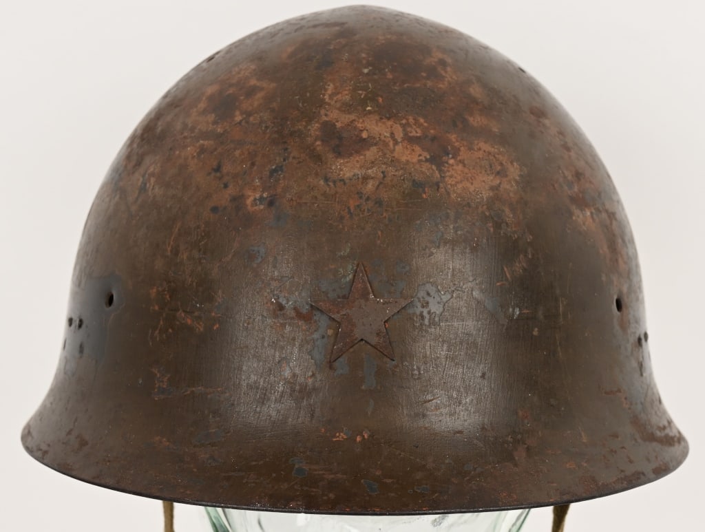 WWII IMPERIAL JAPANESE TYPE 90 COMBAT HELMET WW2: The standard WWII Japanese infantry combat helmet. The shell constructed from chrome molybend steel shows loads of period wear and combat use. The original IJA metal star affixed to the front. The thr