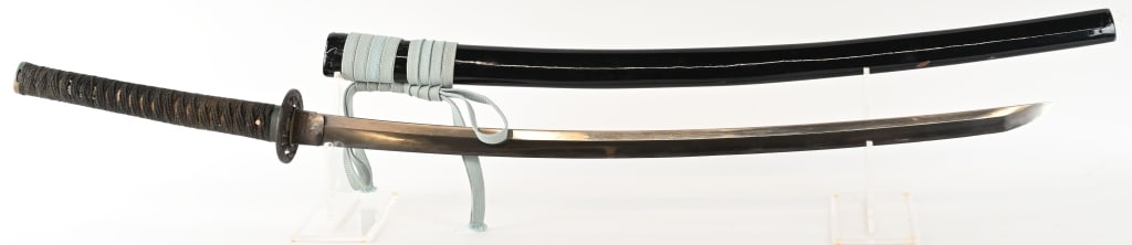 JAPANESE KATANA SWORD w/ SIGNED TANG: 34 5/8" blade with 27 7/8" cutting edge. The blade is bright with an active hamon and is excellent overall. The two hole tang is signed on the left side. The habaki is silver faced copper, and the iro