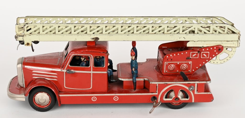 US ZONE GERMANT TIN WINDUP FIRE LADDER TRUCK: Gunthermann tin windup US Zone Germany Fire Ladder Truck. All original and complete with Firemen. Windup works. 14" Excellent