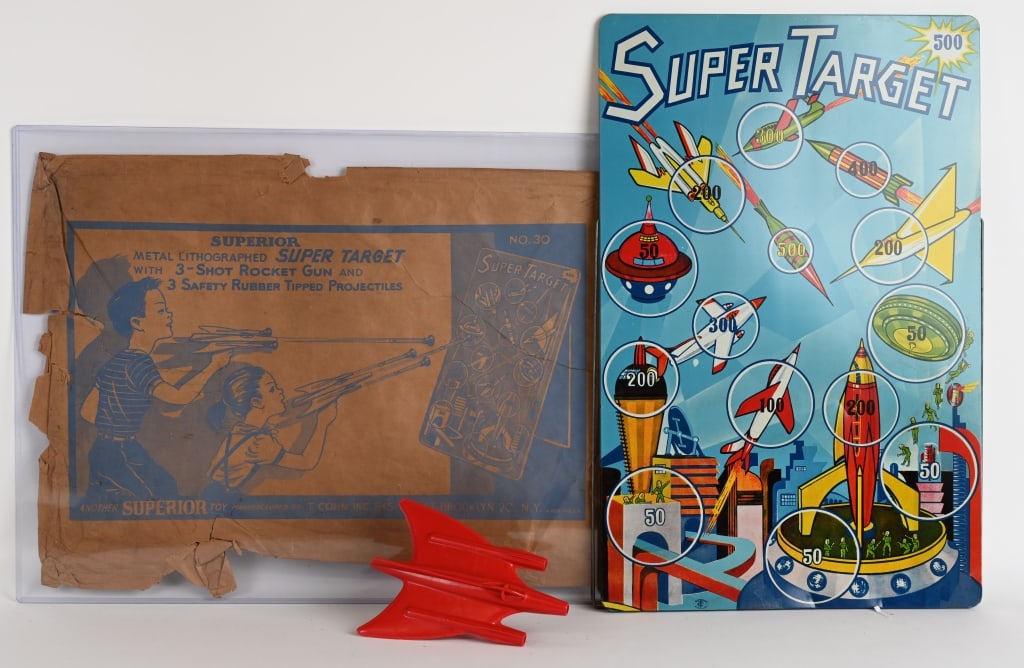 SUPERIOR TIN SPACE TARGET GAME w/ BOX: Beautiful tin litho with nice graphics. Includes Space ship gun and original packaging. No darts are included. 23" by 15" Excellent