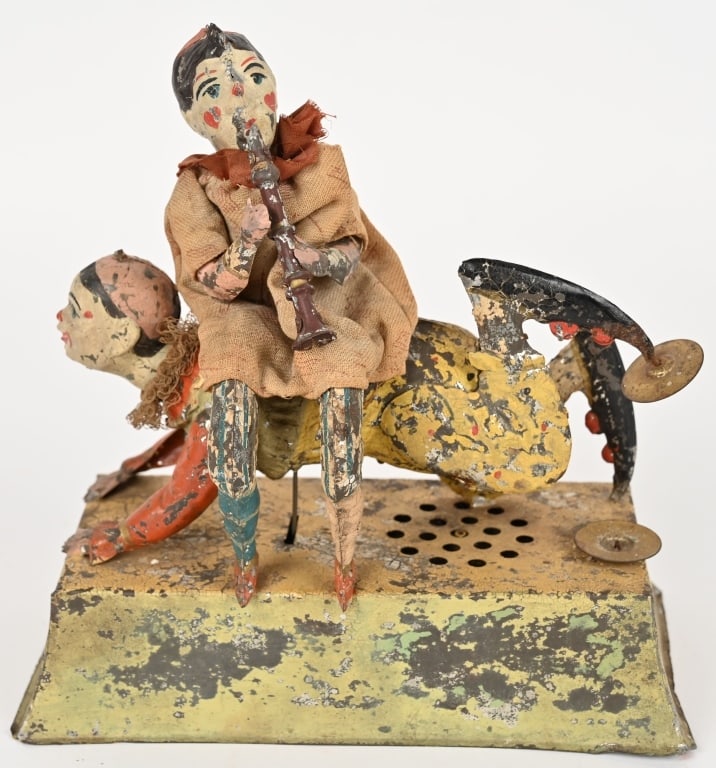 GUNTHERMANN MUSICAL CLOWNS: German hand painted tin windup Musical Clowns. Oversize toy with Clown playing clarinet sitting on Clown playing cymbals with foot. All original. Great looking toy. Windup works and still plays music.