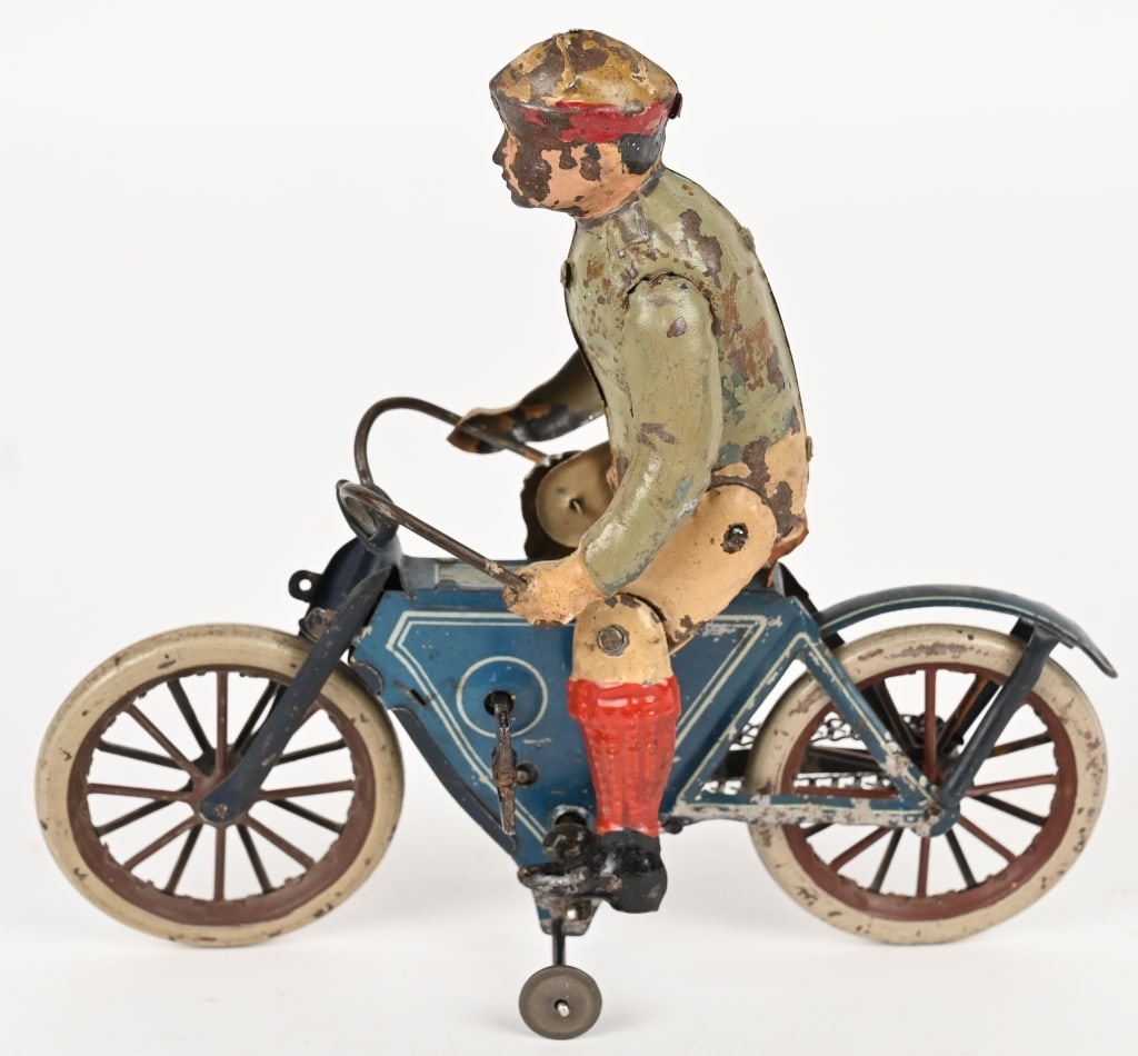 GUNTMERMANN TIN WINDUP MOTORCYCLE w/ RIDER: Early Gunthermann tin windup Motorcycle with hand painted Rider. Unusual color Rider. All original in nice condition. The colors are still very nice and bright. Windup works well. Chain is replaced. A