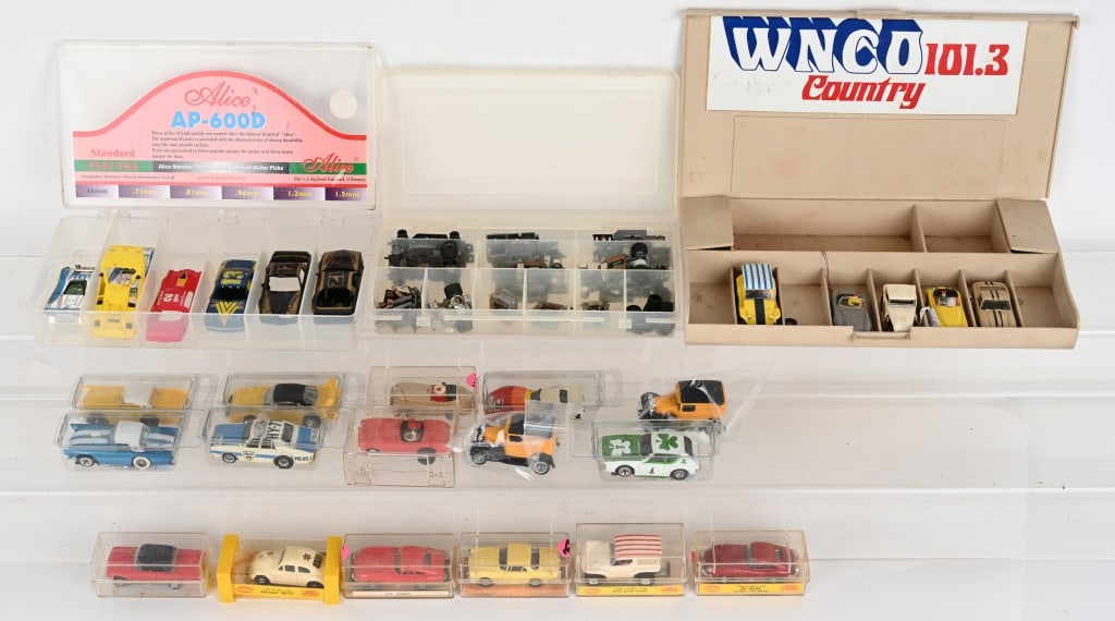 LARGE LOT OF SLOT CARS: Nice lot of vintage slot cars. Some highlights are Aurora No. 1392 Candy Colored XKE Jaguar, Aurora o. 1404 Volkswagwn Beetle, Auora No. 1399 Dune Buggy Coupe and many more. Includes some parts and bo