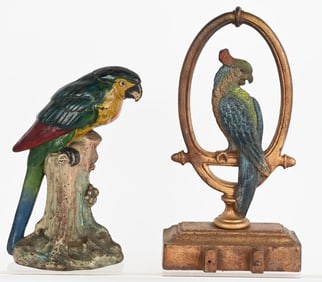 2- CAST IRON PARROT DOOR STOPS