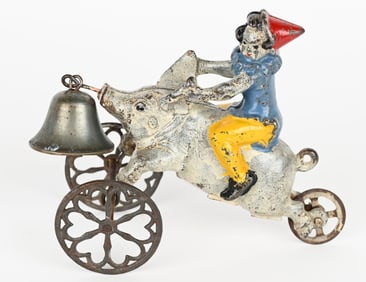 GONG BELL CAST IRON CLOWN RIDING PIG