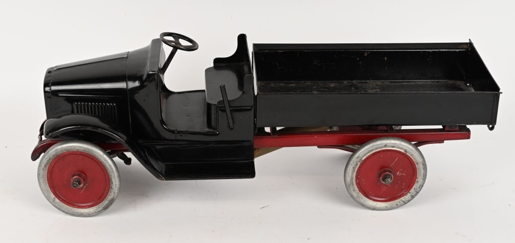 BUDDY L PRESSED STEEL DUMP TRUCK: All original and in exceptional condition. Has very nice paint and decals. Some loss in bed of the truck. 24" Excellent