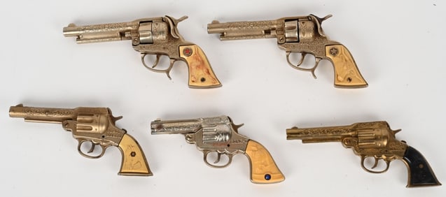 5- CAST IRON COWBOY REVOLVER CAP GUNS