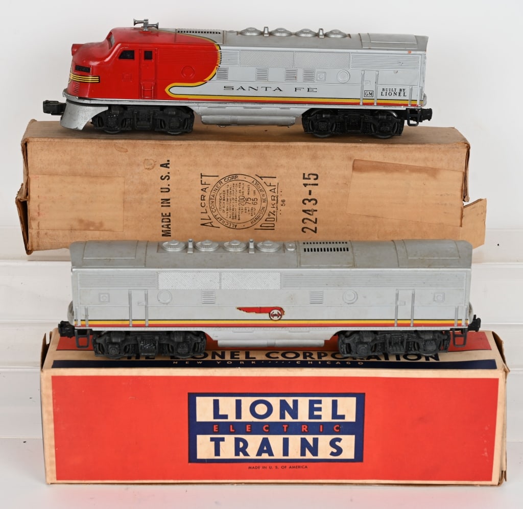 LIONEL SANTA FE DIESEL 2243, & 2243C w/ BOXES: The 2243 Diesel engine has some rubs on the body and rust in the battery box. The the 2243C could use some cleaning.