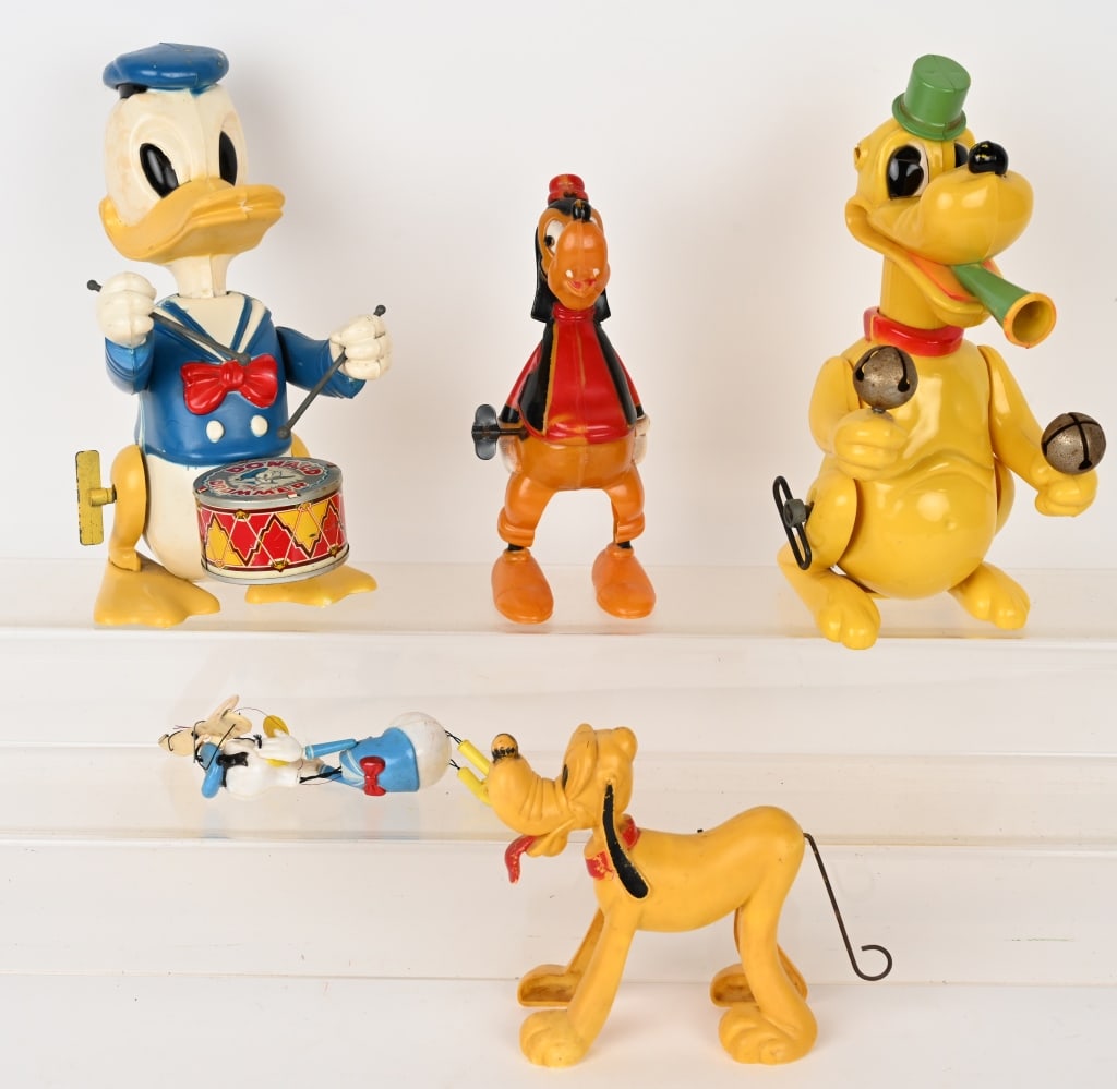 4- MARX PLASTIC WINDUP DISNEY TOYS: Lot includes: 1. 10" Donald Duck working, 2. 10" Pluto working, no ears, 3. 6" Pluto, not working, 4. 8" Goofy not working. Also included is a small plastic Donald Duck doll. As-IS