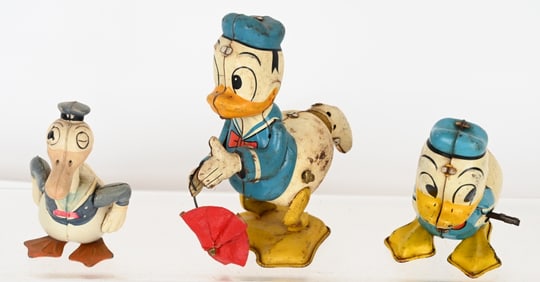 3- DONALD DUCK WINDUP TOYS