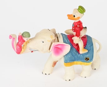 JAPAN CELLULOID WINDUP DONALD DUCK ON ELEPHANT