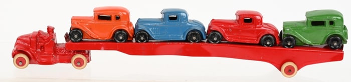1930's SLUSH CAST CAR HAULER & 4 CARS