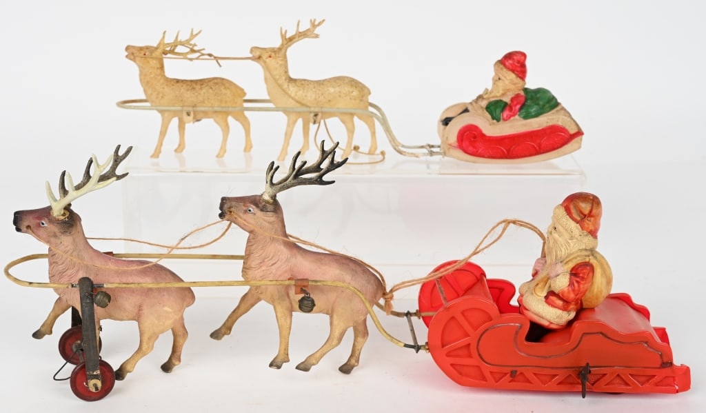2- PRE WAR JAPAN CELLULOID SANTA CLAUS TOYS: Lot includes: 15" Celluloid windup Santa Sleigh, windup works. minor celluloid damage to runners at back of sled. One antler is replaced on front reindeer. 2. 12 1/2 Santa Sleigh, on Mechanical. Very