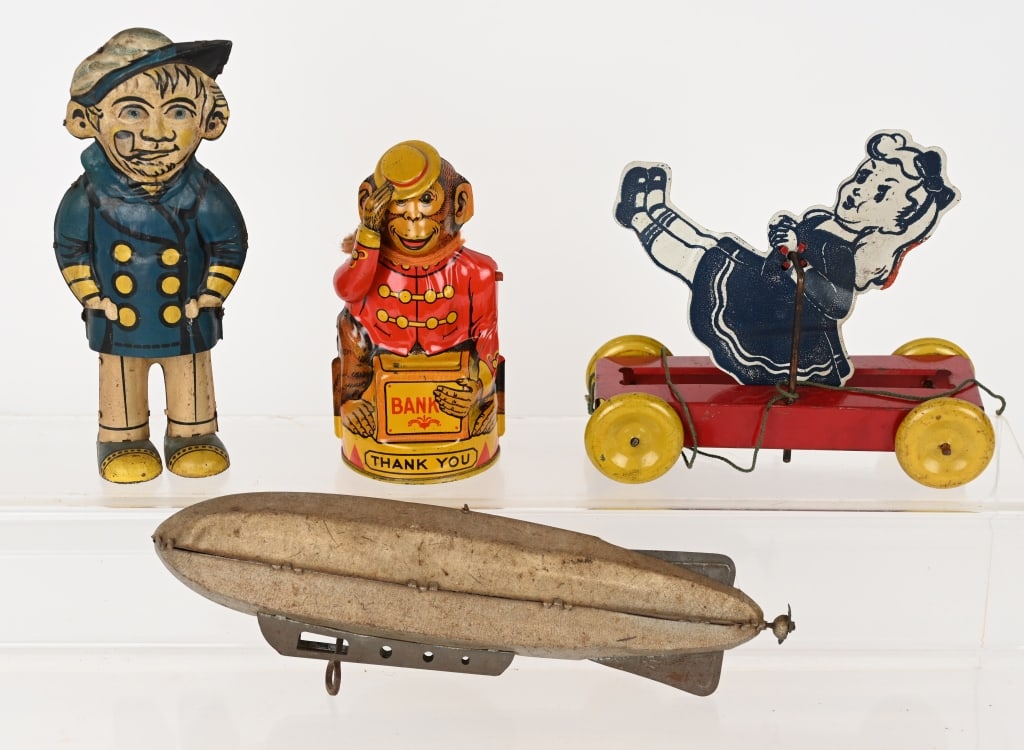 VINTAGE TIN TOY LOT: Lot includes Chein Monkey Tips Hat bank, German Sailor tin windup, not working, Marz Zeppelin, working, missing prop, and Unusual Tumbling Girl pull toy. Largest is 9" AS-IS