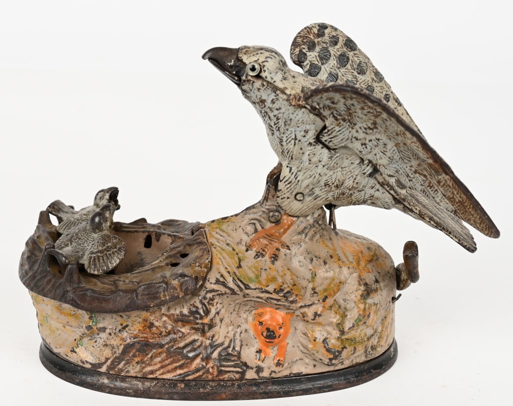 J&E STEVENS EAGLE & EAGLETS MECHANICAL BANK: Eagle and Eaglets cast iron mechanical bank. All original Mechanism and bellows work. No cracks or repairs. 8" Very Good FROM THE COLLECTION OF ED STEINBERGER