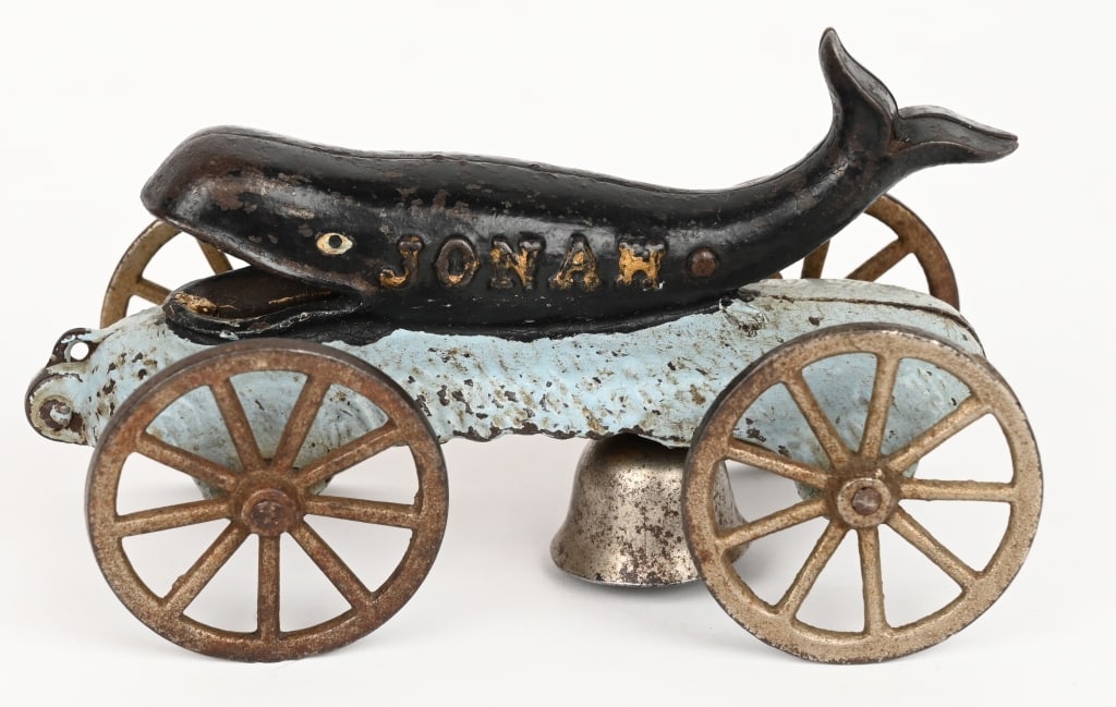 N.N. HILL JONAH AND THE WHALE BELL TOY: Cast iron Jonah and the Whale bell toy. Complete and original. No cracks or repairs. 5 3/4" Excellent