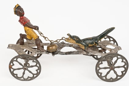 GONG BELL BOY AND ALLIGATOR CAST IRON BELL TOY