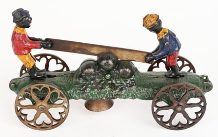 N. N. HILL CAST IRON BOYS SAWING WATERMELON