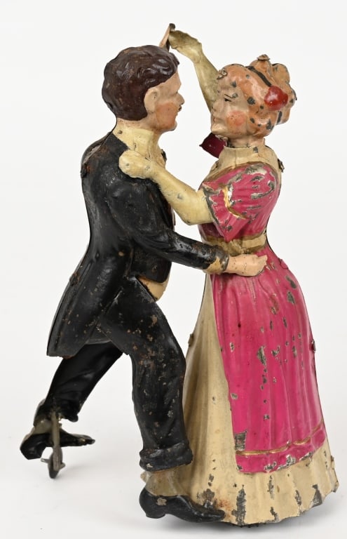 GUNTHERMANN TIN WINDUP WALTZING COUPLE: Original German Gunthermann hand painted tin windup Waltzing Couple Worked well when tested. 8" Excellent