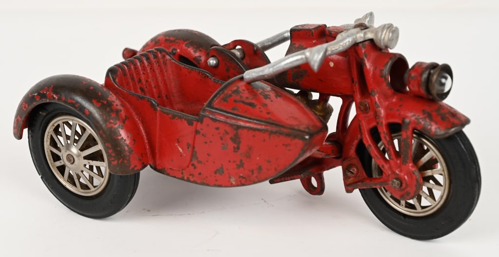 HUBLEY ELECTRIC LIGHT MOTORCYCLE w/ SIDECAR: Hubley cast iron Electric Light Motorcycle. Scarce motorcycle toy. Has no cracks or repairs and original tires. Missing clicker. 9" Very Good-Excellent