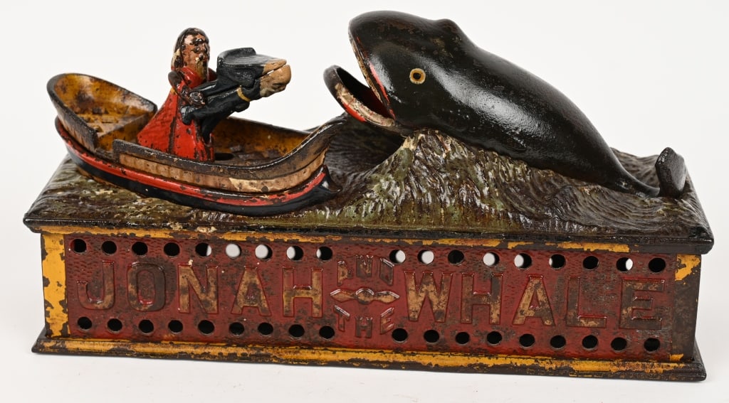 SHEPARD JONAH AND THE WHALE MECHANICAL BANK: Jonah and the Whale cast iron mechanical bank. The bank has original paint that has been varnished. The Jonah figure and the trap are correct replacements. No cracks or repairs. Works well. 10 1/2" Ve