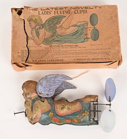 LADIS TIN WINDUP FLYING CUPID w/ BOX