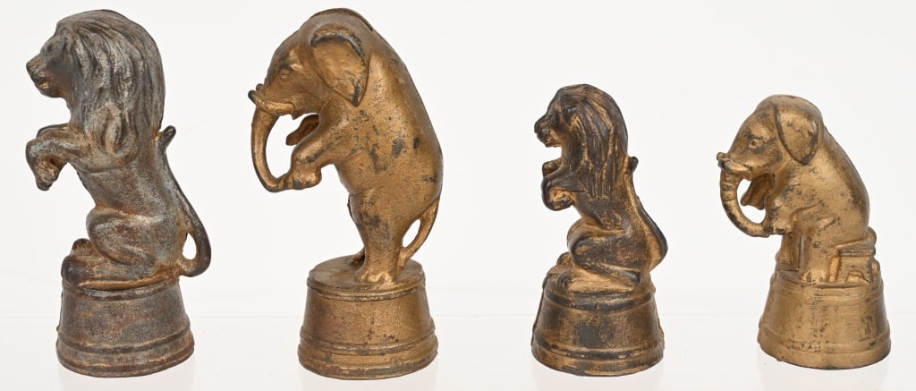 ELEPHANT & LIONS ON TUBS STILL BANKS: Includes 2 Elephants and 2 Lions on Tubs Still Banks. All original condition. Largest 5 1/4" Very Good-Excellent