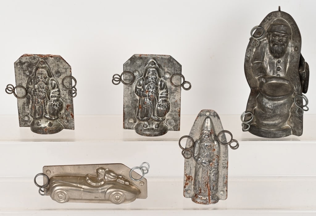 5- ANTIQUE SANTA CLAUS CHOCOLATE MOLDS: Includes Standing Santa with Bag marked Anton Reich 20256 S 3, Santa Driving Sports Car Marked Made in Germany 1026 15, Standing Santa with Bag marked Jaburg Brothers USA 11, Standing Santa marked 11,