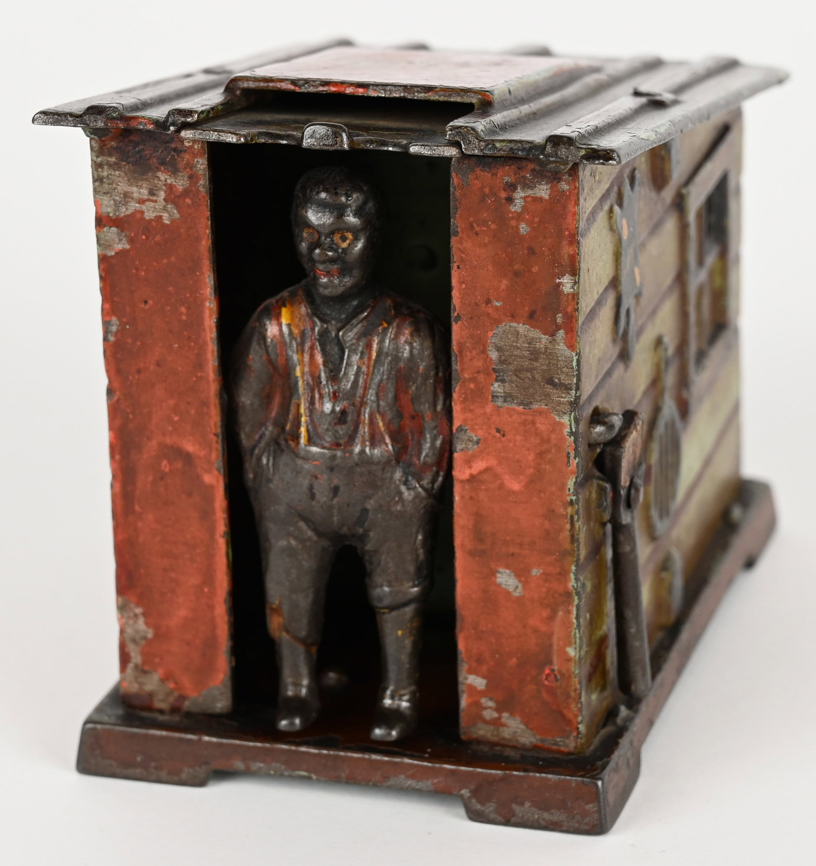 J&E STEVENS CABIN MECHANICAL BANK: Cabin cast iron mechanical bank with good original paint.. May clean to a higher grade. No cracks ore repairs. Has old varnish that has discolored. Trap is replaced. Works properly. 4" Very Good
